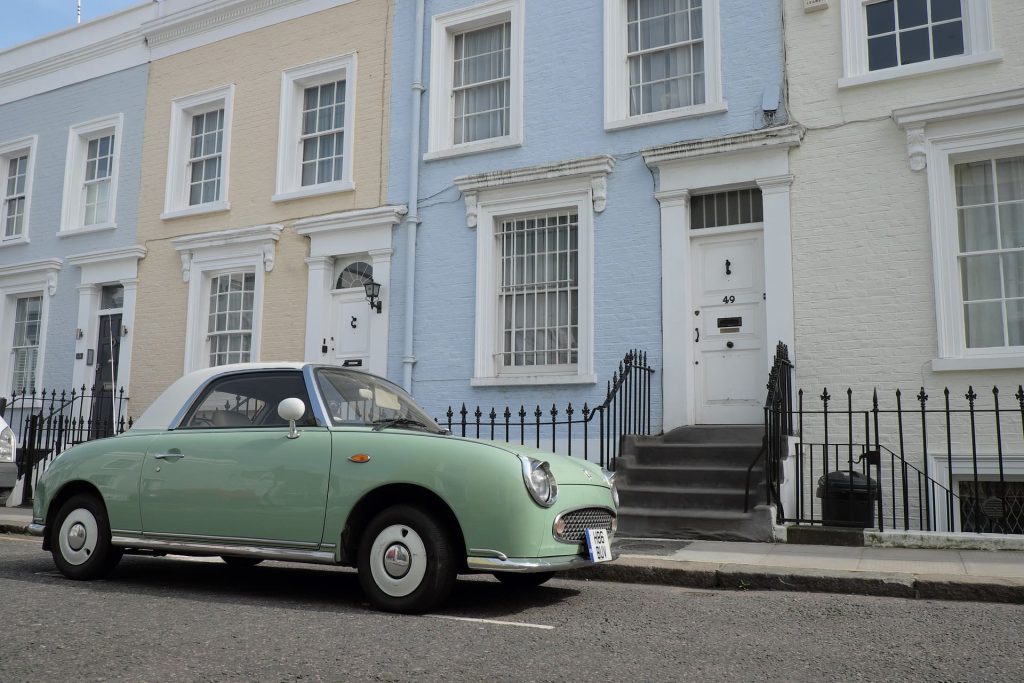 Adding value to your home | Kerb appeal | Houses with fresh paint and a green old style Italian car