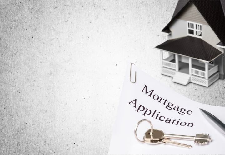 Mortgage Applications | Toy house with keys and a mortgage application, pen and keys