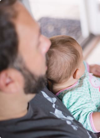 Life Assurance | Image of a father with a young child on his lap