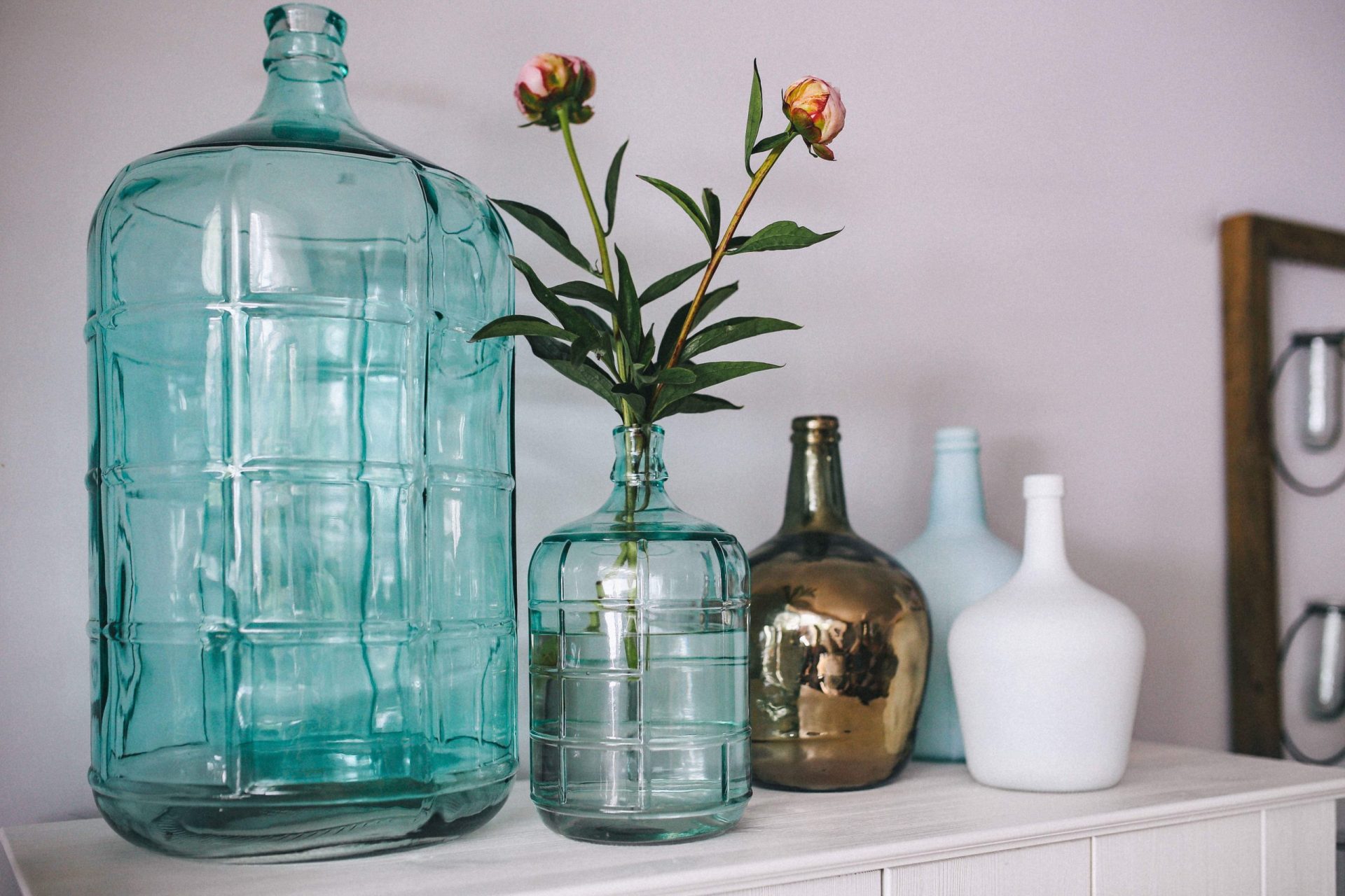 Mortgages for Sole Traders | Glass vases with flowers in on a sideboard