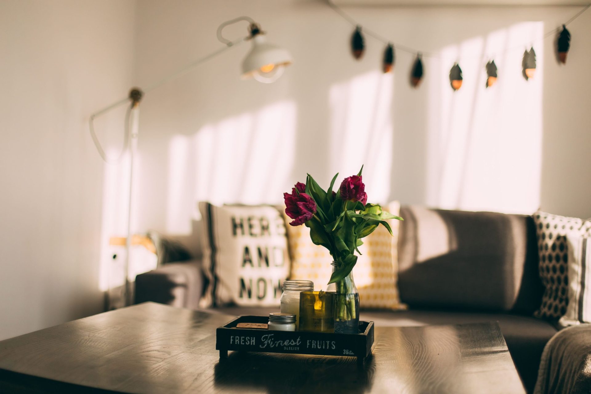 Bad credit secured loans | A coffee table in the middle of a living room that is being lit up by sun light