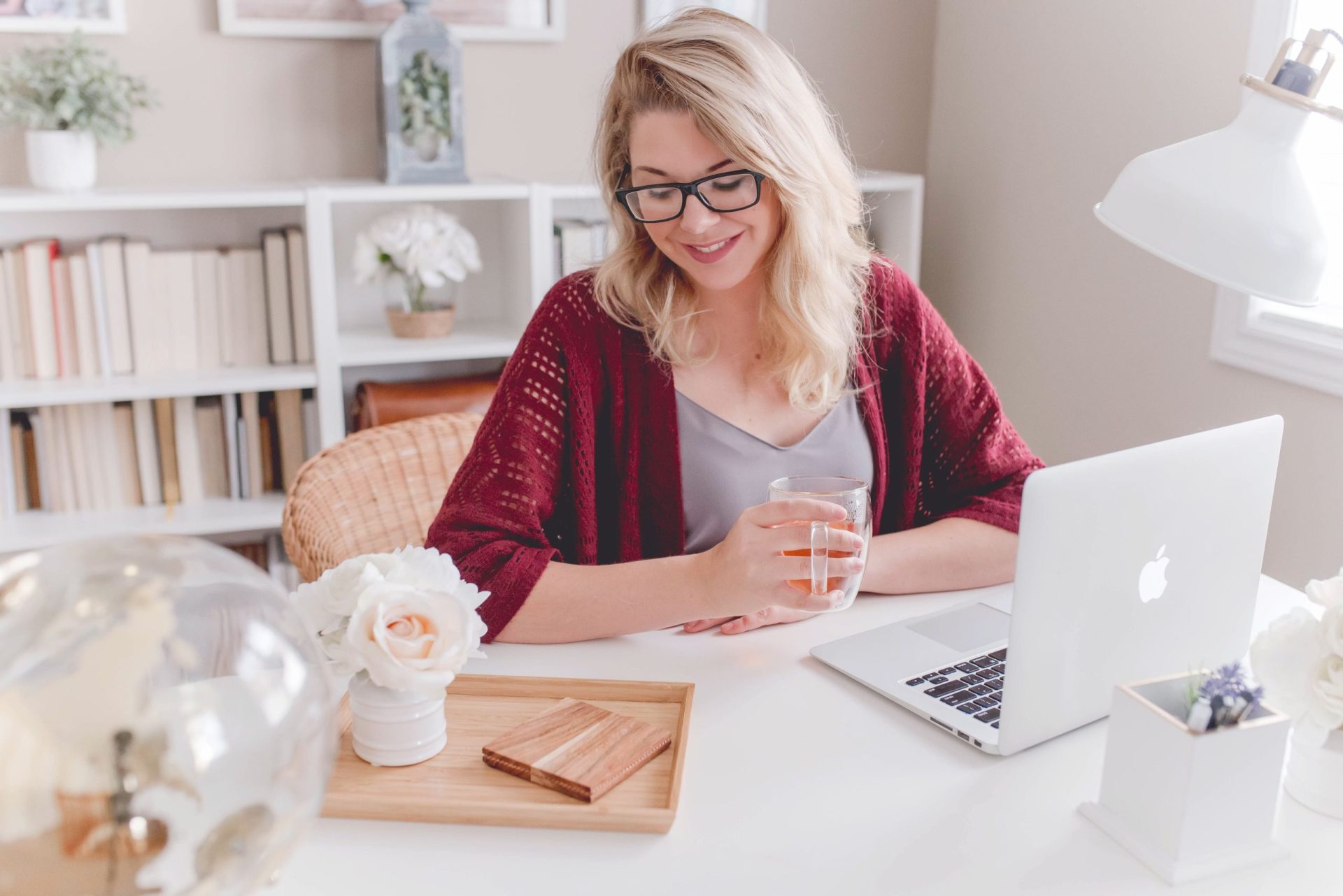 Self-employed mortgages | Lady sat at desk with a cup if tea working on her laptop